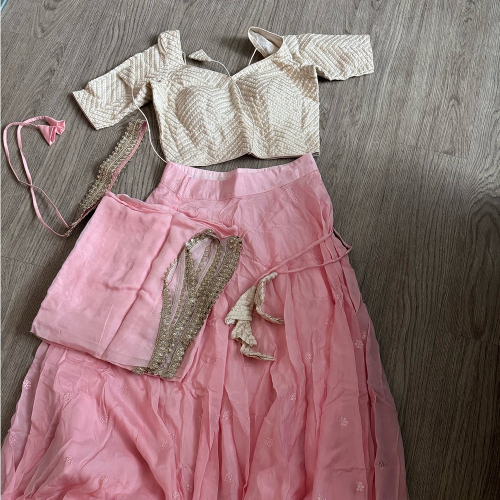 Pink lengha with cream blouse